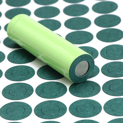 Set of 50 green 18650 battery terminal gaskets with white rollers, designed for secure battery connections.