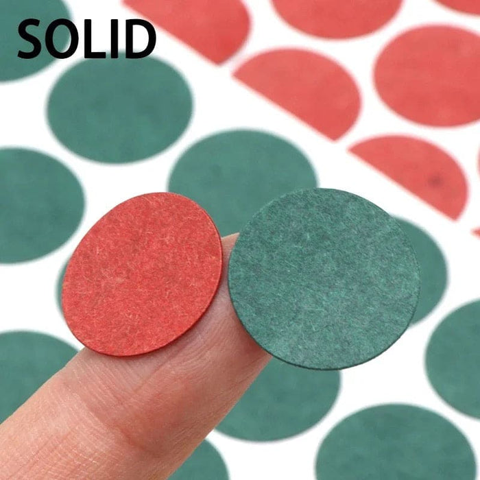 Set of 50 18650 battery terminal gaskets with hand holding two circular gaskets, designed for battery terminal sealing.