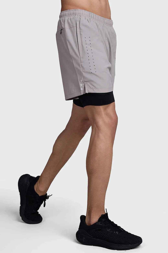 Fuaark Nz 2-in-1 laser shorts in beige with black accents, showcasing stylish design and comfortable fit.