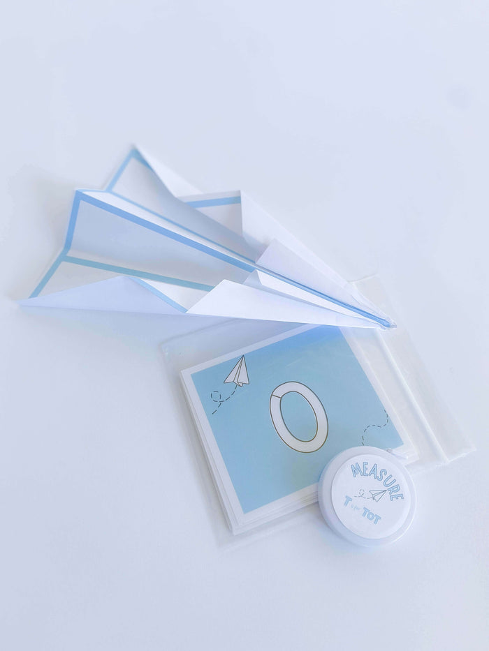 Children's airplane play kit with multiple activities, including airplane playdough cutter, non-toxic playdough, four airplane construction sets, pilot license, airplane tickets, and a children's book about airplanes
