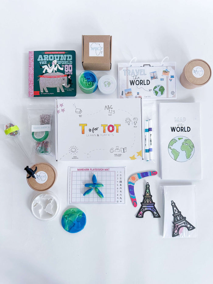 Kids' Around the World kit with board book, playdough cutter, Travel the World pack, custom made map, and craft activities from six continents. Includes boomerang-making, Eiffel Tower craft, Mandarin learning, and science experiments.