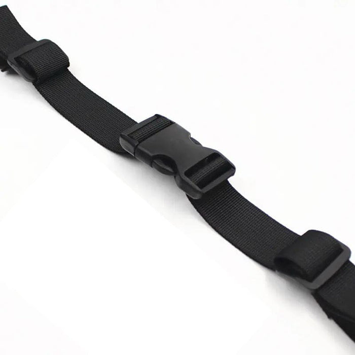 Black 9eight5 backpack chest strap attached to a backpack, adjustable strap for comfort and secure fit during outdoor activities.