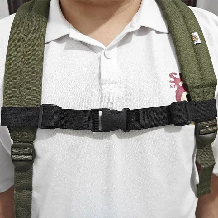 Black 9eight5 backpack chest strap attached to a backpack, adjustable shoulder strap for comfortable carrying and weight distribution.