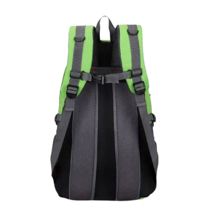 Green and black 9eight5 backpack with multiple compartments and adjustable straps, suitable for school or travel.