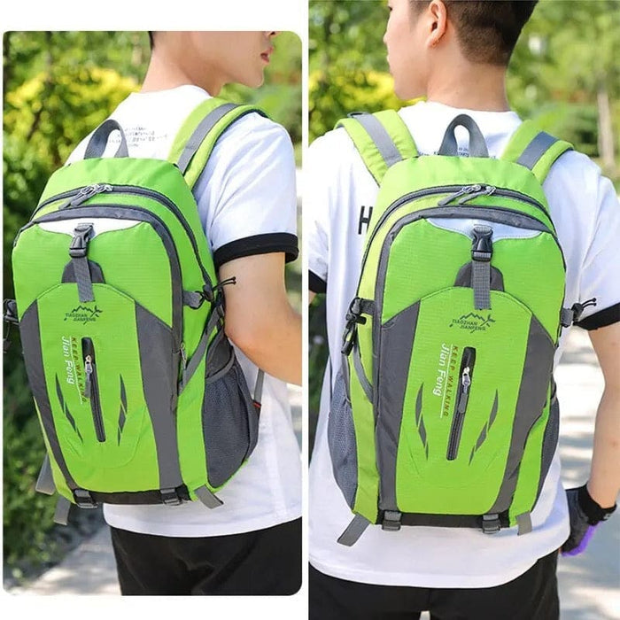 Green and black 9eight5 backpack with multiple compartments and adjustable straps, ideal for school or travel.