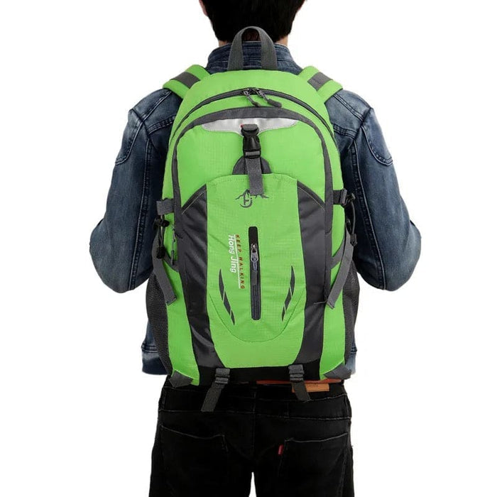 Green and black 9eight5 backpack with multiple compartments and adjustable straps, suitable for travel and everyday use.