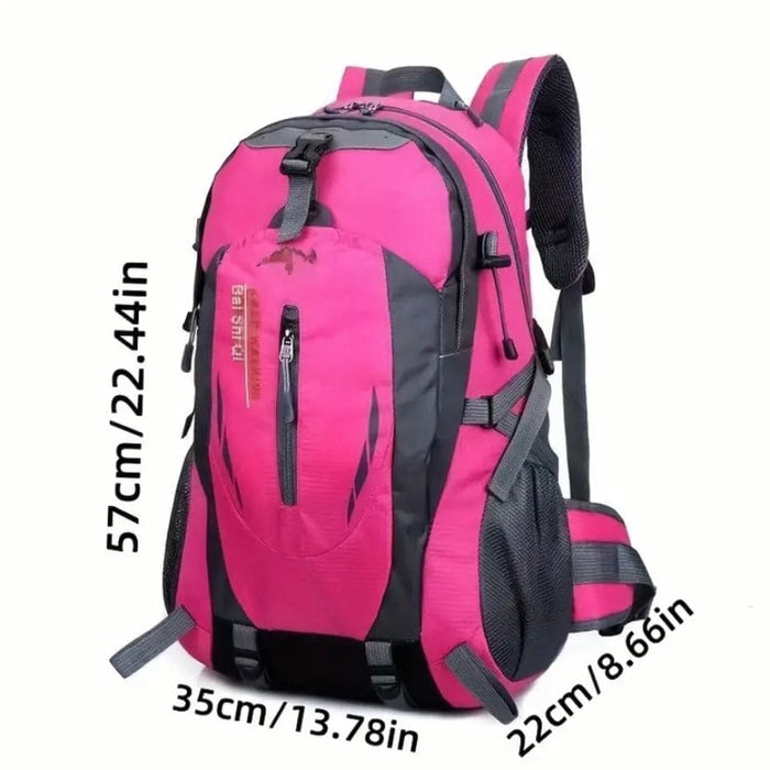 Pink 9eight5 backpack with adjustable straps and multiple compartments shown in the image.