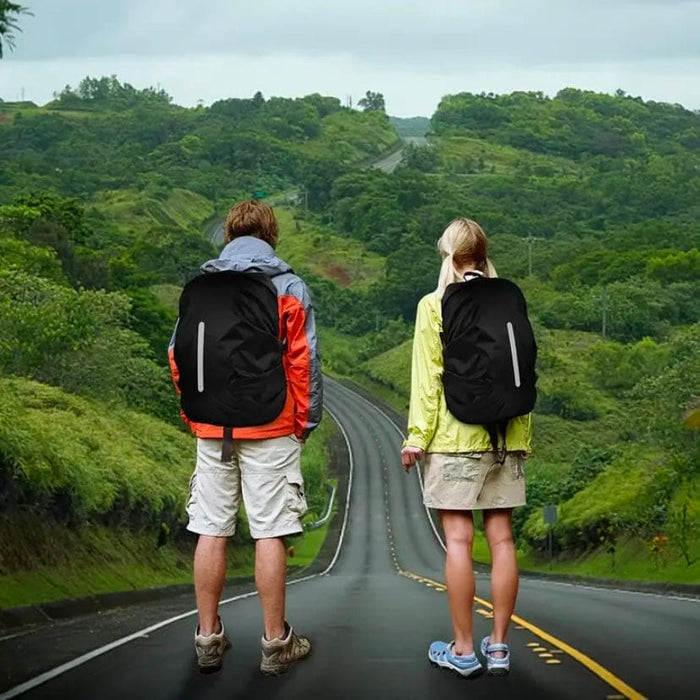 Black waterproof backpack cover by 9eight5 shown protecting a backpack from rain, designed to keep contents dry in wet weather.