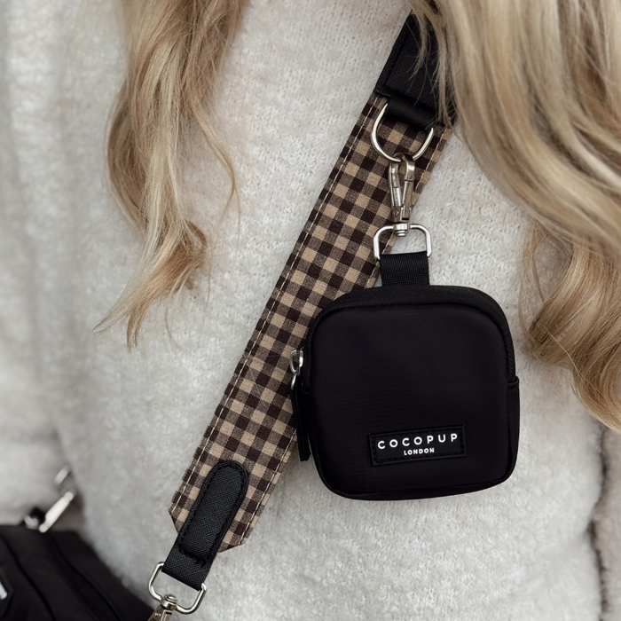 Cocopup London Cotswold Check bag strap in plaid pattern worn over a cream sweater by a person with long blonde hair.