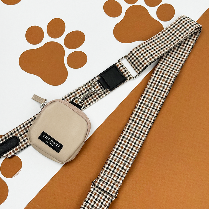 Cocopup London Heritage Check bag strap with classic check pattern, displayed on a brown surface with paw prints.