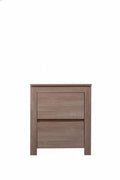 Light oak Byron bedside table by sue-e furniture with two drawers and modern design, shown in a cozy bedroom setting.