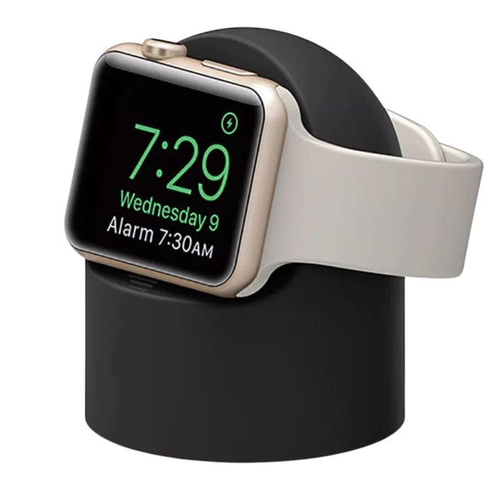 Apple Watch charging stand by That Watch Shop in six colors, shown holding an Apple Watch on a clean, modern desk setup.