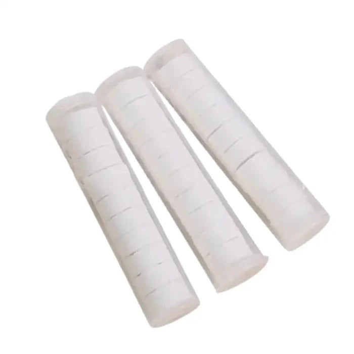 Habicare compressed travel and camping towel in a compact form, perfect for outdoor adventures and quick drying.