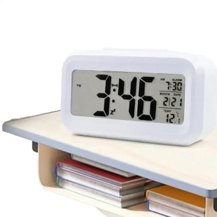 Habicare HBC digital alarm clock with battery power, indoor temperature display, light sensor, and adjustable backlight in three colors