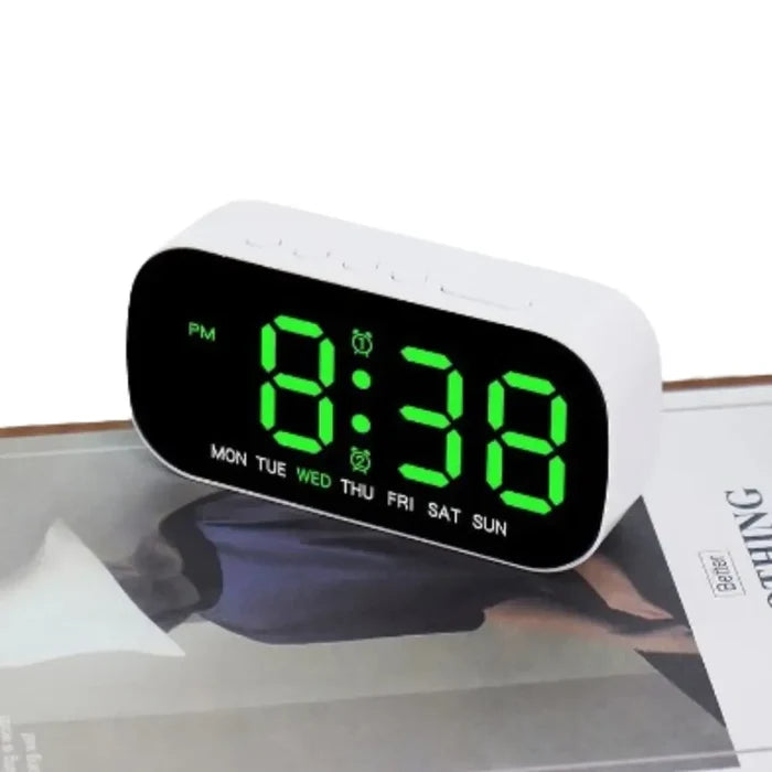 HBC Habicare digital alarm clock with USB-powered LED display in various colors, compact and modern bedside timepiece.