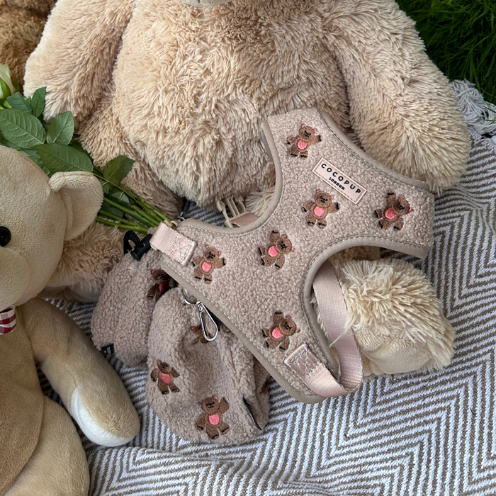 Beige teddy bear dog harness on a plush bear, beside a tan Cocopup London Theo Embroidered Teddy treat pouch.
