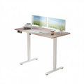 Electra Ergo single motor sit stand computer desk in walnut finish, 1.4m long, from Sue-E Furniture, showing the desk's sleek surface.