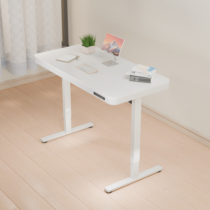 White ErgoLift single motor sit-stand computer desk with drawer, 1.2m length, by sue-e furniture, shown with adjustable height and workspace.