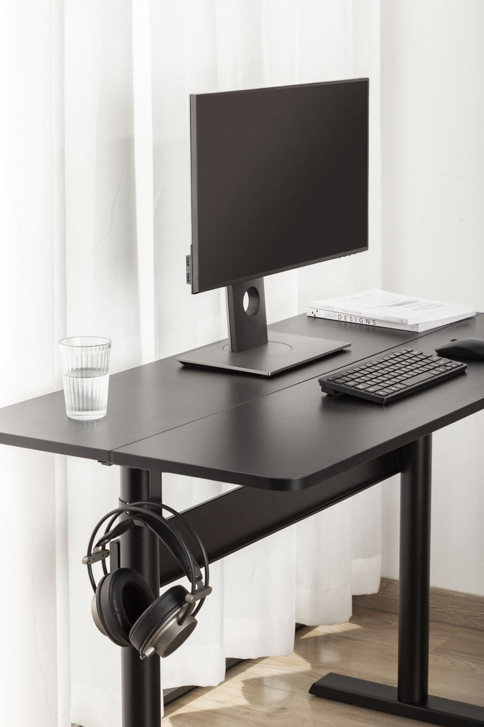 Sue-e Furniture Ergomax gas spring sit-stand computer desk with adjustable height and modern workspace setup.