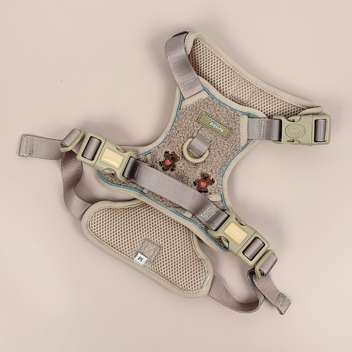 Beige and gray Cocopup London Explore dog harness with Theo embroidered teddy, adjustable straps, and metal ring, flat lay.