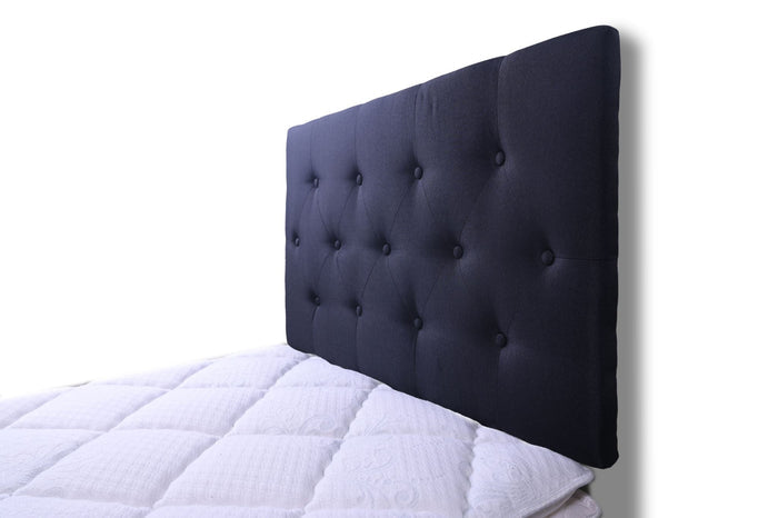 Black single Fenland headboard by sue-e furniture, showcasing a sleek, modern design with a smooth, upholstered surface.