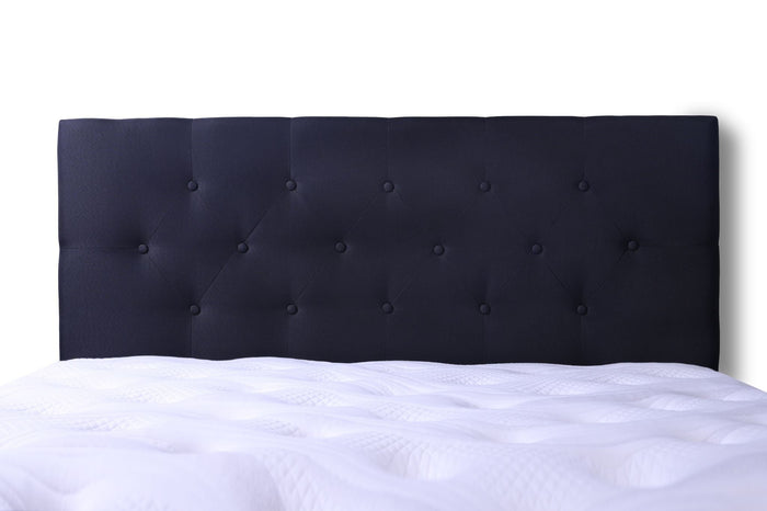 Black super king Fenland headboard by sue-e furniture, showcasing a sleek, modern design with a padded fabric surface.