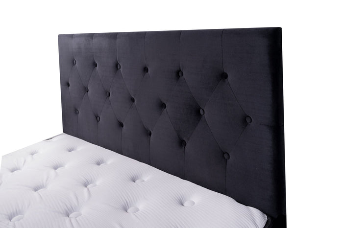 Black velvet king size Fenland headboard by Sue-E Furniture, featuring a plush, padded design with elegant tufting.