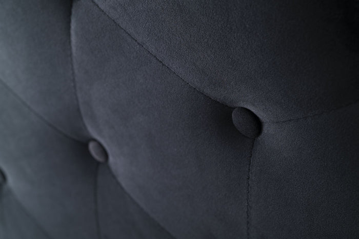Black velvet king size Fenland headboard by sue-e furniture, showcasing plush upholstery and elegant design.