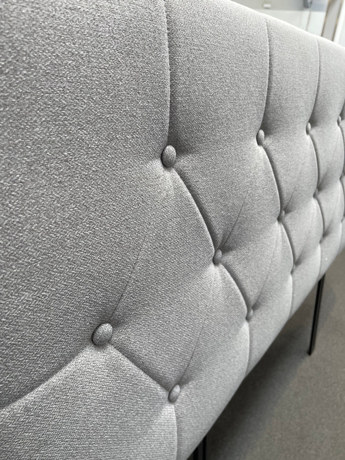 Light grey Sue-e Furniture Fenland Queen headboard with a modern design, shown in a well-lit bedroom setting.