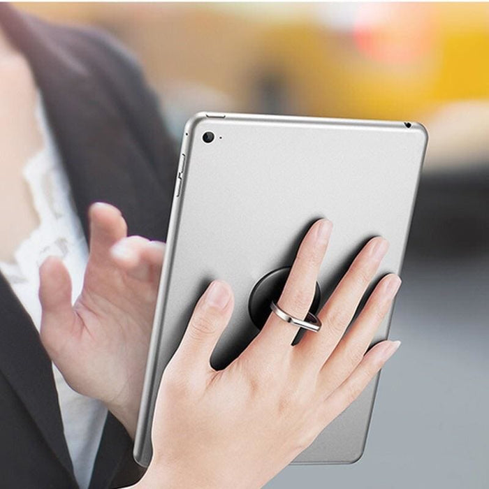 Pink Finger Grip accessory for phones and tablets by 9eight5, showing a close-up of the textured grip on a device.