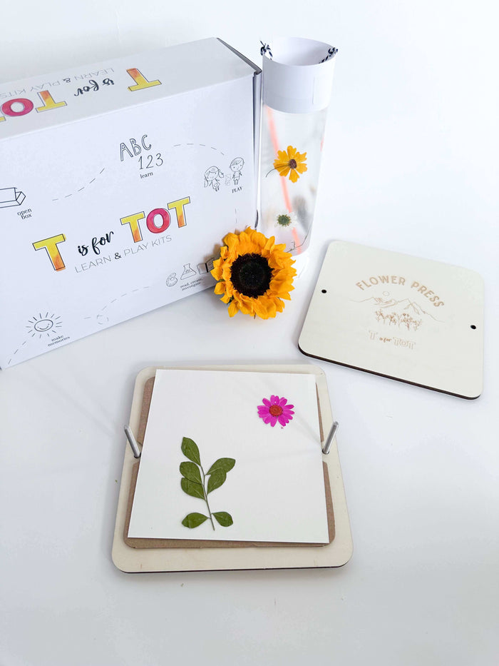 Kids' flower press kit for nature-inspired crafts. This custom-made press allows children to create unique designs with flowers and leaves. Ideal for engaging play and creative exploration.
