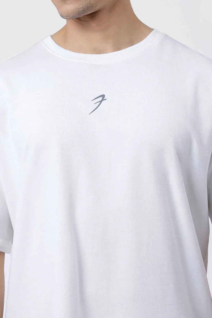 White oversized Fortitude T-shirt by Fuaark Nz featuring a relaxed fit and casual style, shown on a plain background.