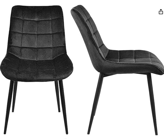 Black velvet Gavin dining chair by sue-e furniture with modern, upholstered design and sturdy wooden legs.