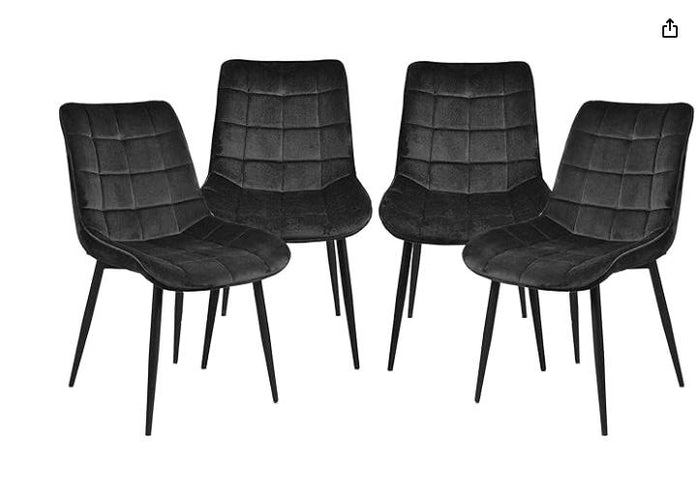 Black velvet Gavin dining chair by sue-e furniture, showcasing sleek design and plush upholstery with wooden legs.