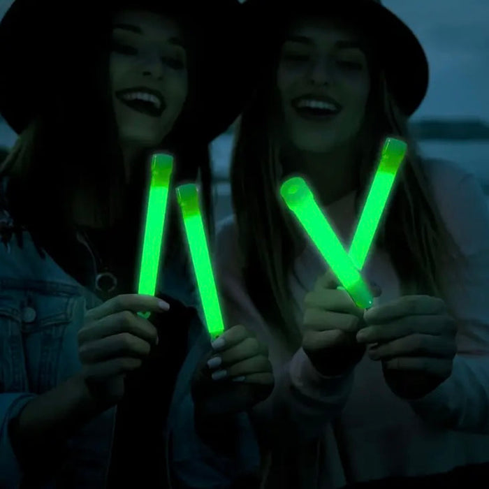 Set of five 9eight5 glow sticks for multipurpose tools and kits, glowing brightly in various colors against a dark background.