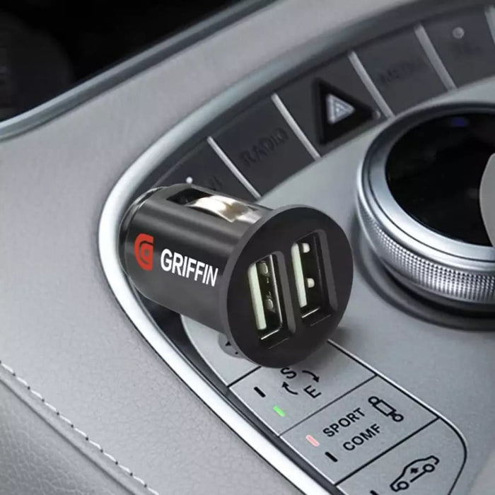 9eight5 Griffin car charger for phone and tablet, compact device with USB port and sleek design for in-car charging.