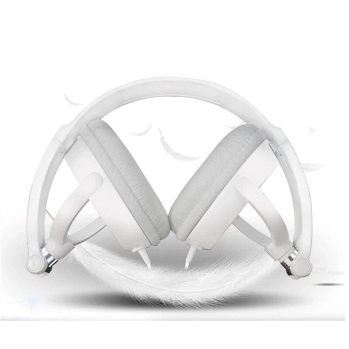 White 9eight5 headphones resting on a furniture table, showcasing sleek electronic accessories with comfortable ear cushions.
