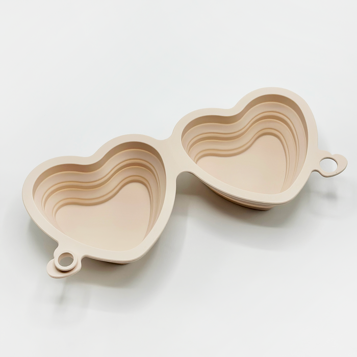 Pink heart-shaped collapsible bowls from Cocopup London, nested and displayed side by side on a white background.