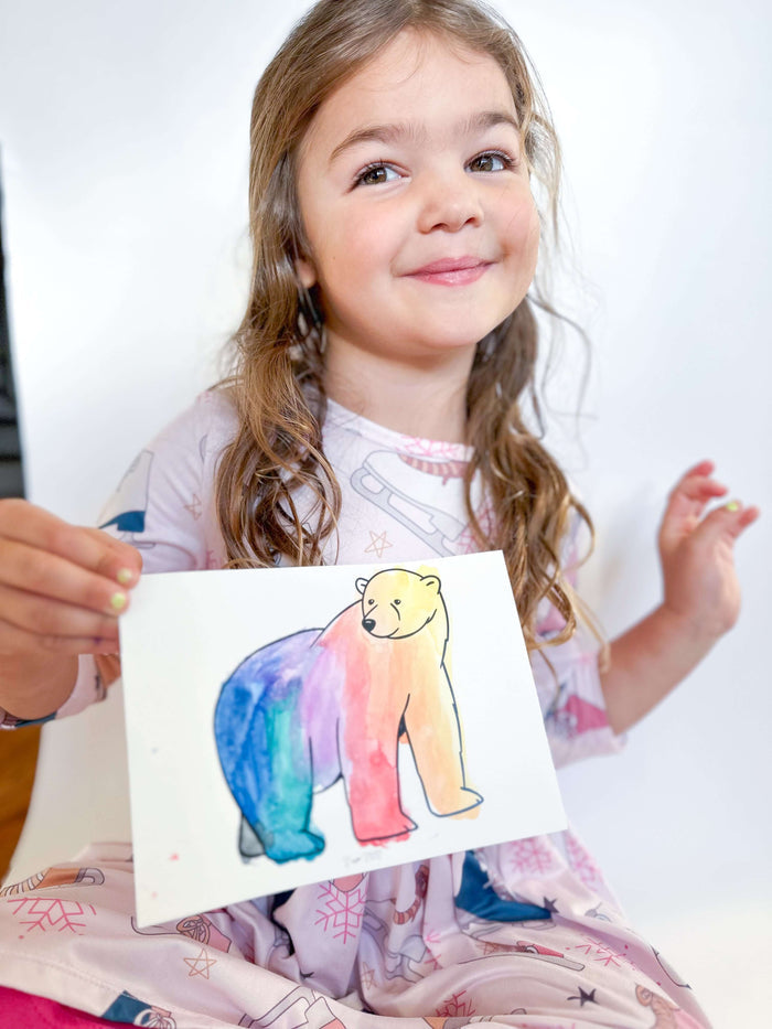 Preschooler conducting science experiments from T is for Tot's Hibernation Kit