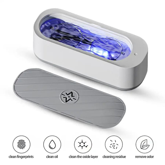 Battery-powered high-frequency vibration cleaner for watch tools, removing fingerprints and dirt from watch components.