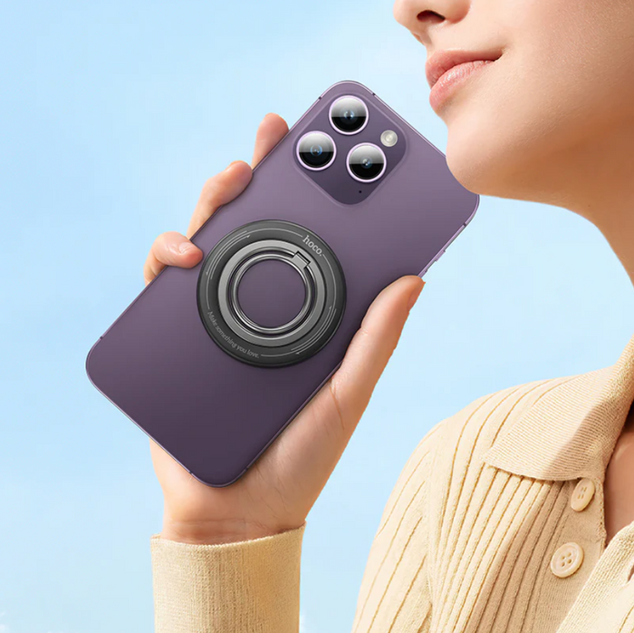 Techplus Hoco magnetic ring holder for phone grip, 360-degree rotation, shown attached to a smartphone for secure handling.