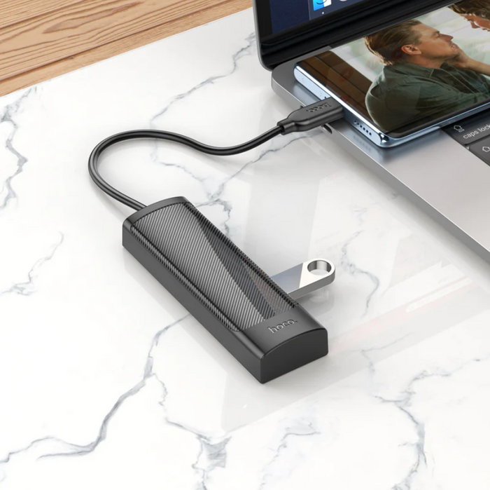 Techplus Hoco USB-C to USB-A 4-in-1 expansion hub showing multiple ports for versatile device connectivity.
