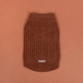 Rust-colored cable knit dog jumper with a cozy, textured finish.