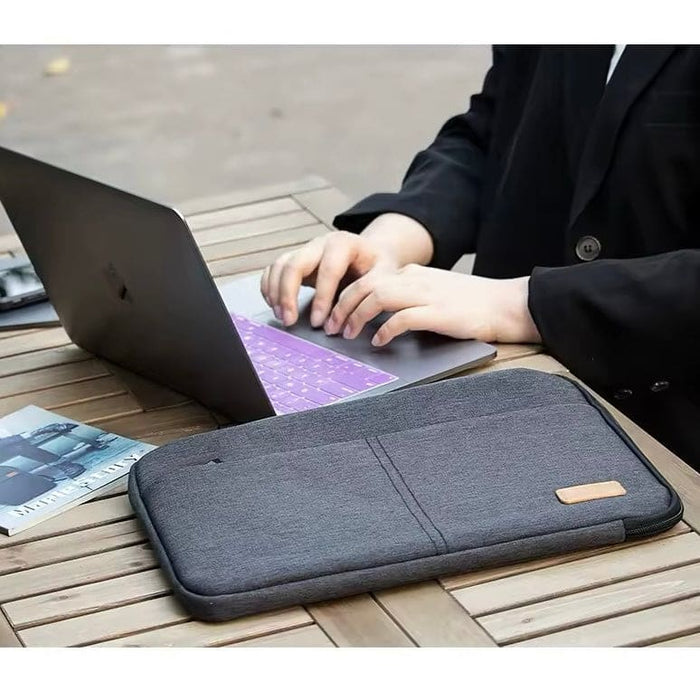 Black 15.6-inch 9eight5 laptop bag with padded compartment, adjustable strap, and sleek design for secure carrying.