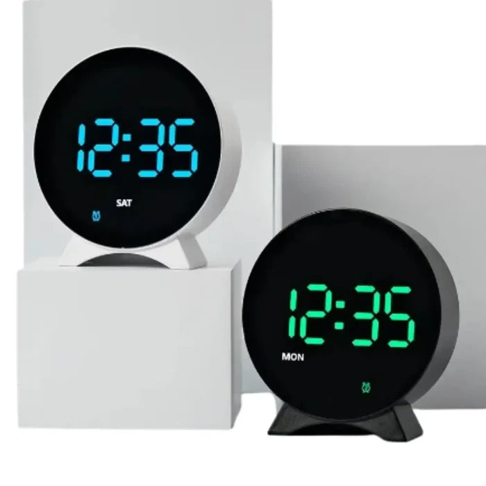 Habicare HBC LED digital alarm clock with adjustable brightness, dual alarms, and date and temperature display on a white background.