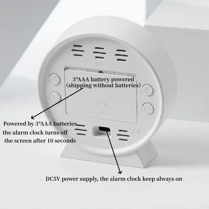 Habicare LED digital alarm clock with adjustable brightness, dual alarms, date, and temperature display on a sleek black clock face.