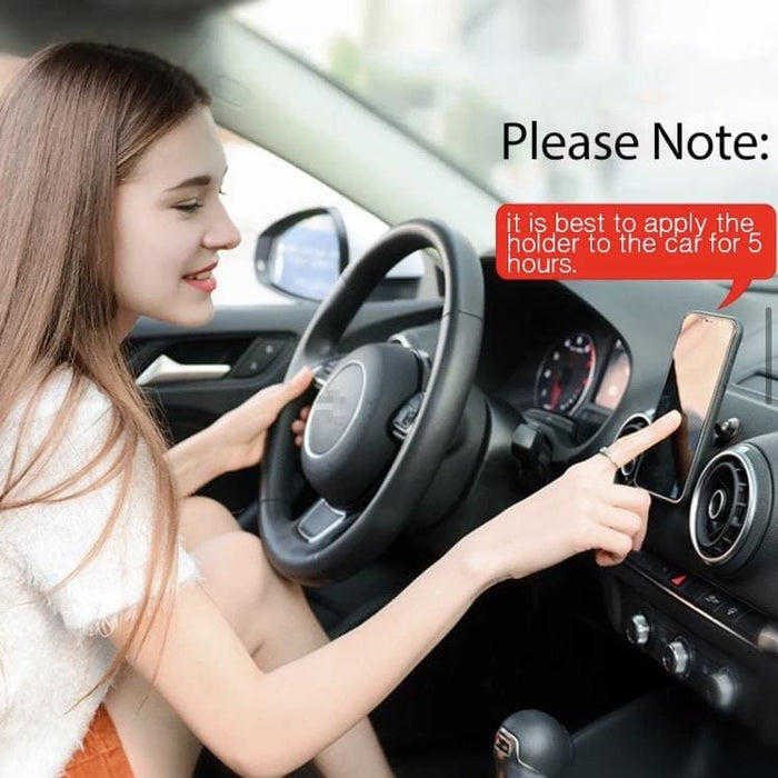 Black magnetic phone holder for vehicle, compatible with phones and tablets, designed for secure mounting and easy access.
