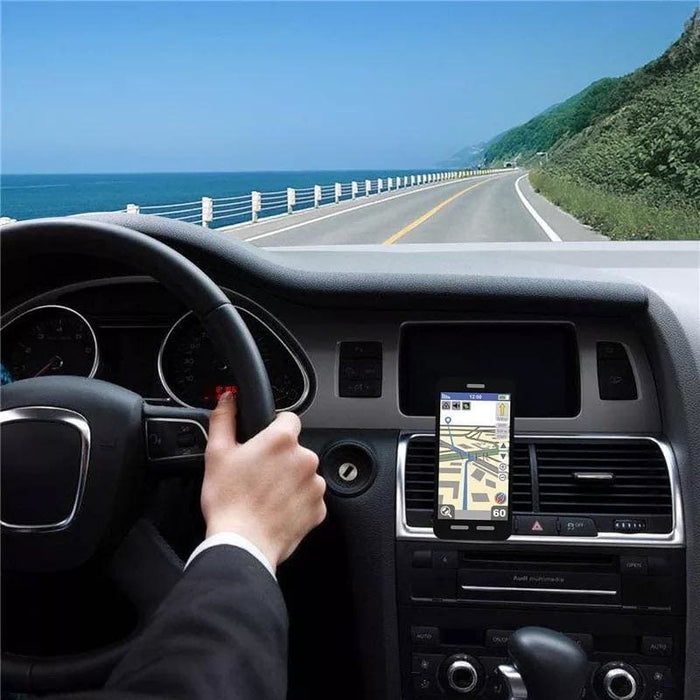 Magnetic phone holder by 9eight5 showing a sleek black design attached to a car dashboard for hands-free device use.