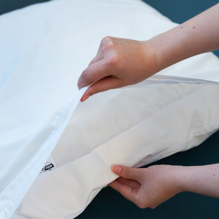 Open MiteGuard cushion cover showing a large protective zip flap for mite protection on cozy cushion.