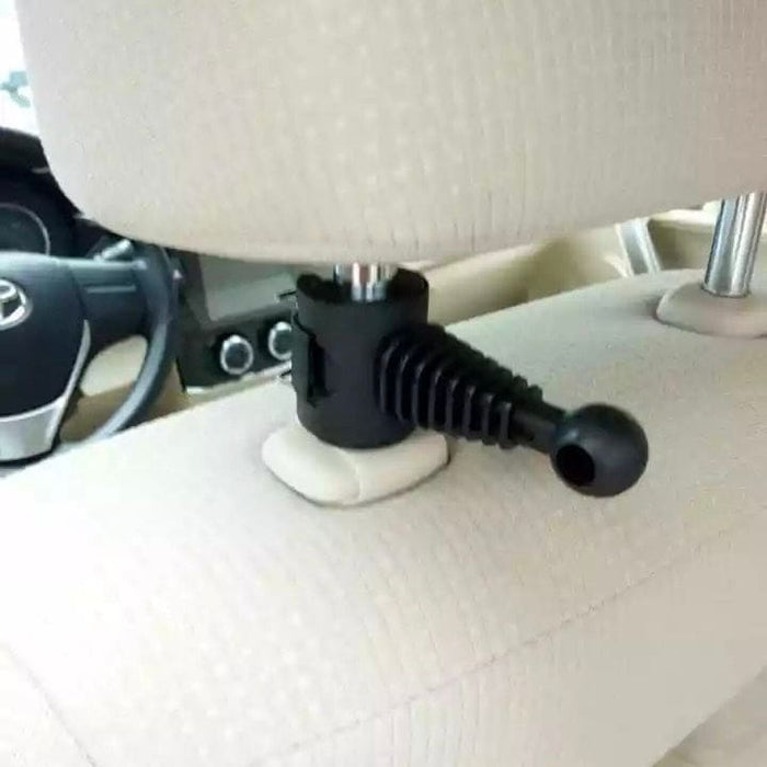 9eight5 mobile phone headrest holder attached to car headrest for hands-free phone and tablet viewing during travel.